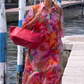 Rode jurk van chiffon met bloemenprint