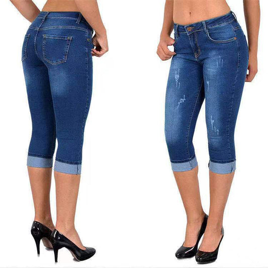 Capri-jeans met gescheurde, opgerolde zoom